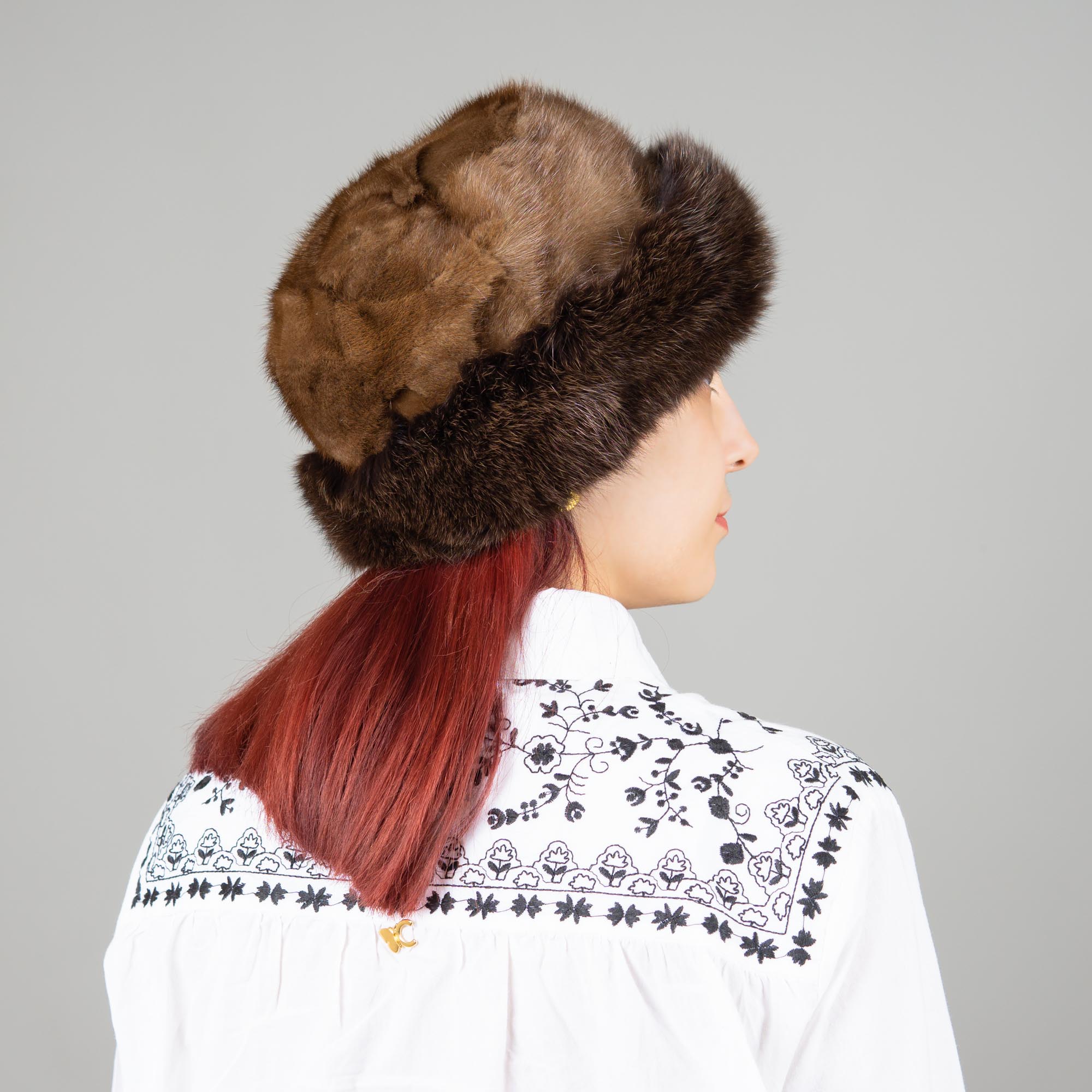 Hat of mink and fox fur in brown color