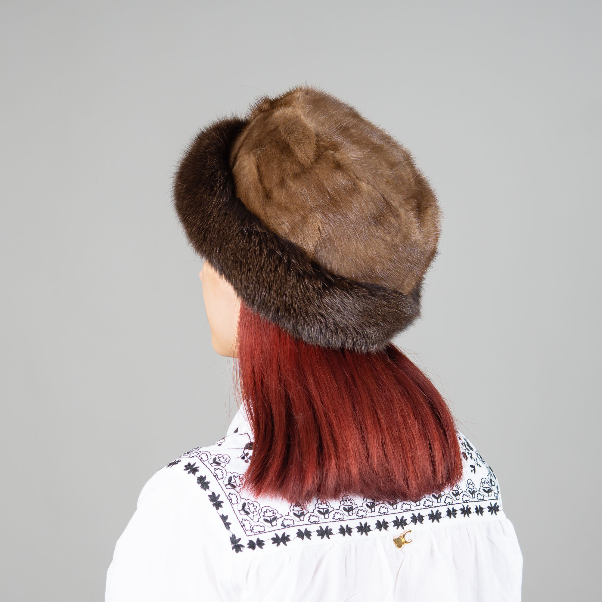 Hat of mink and fox fur in brown color