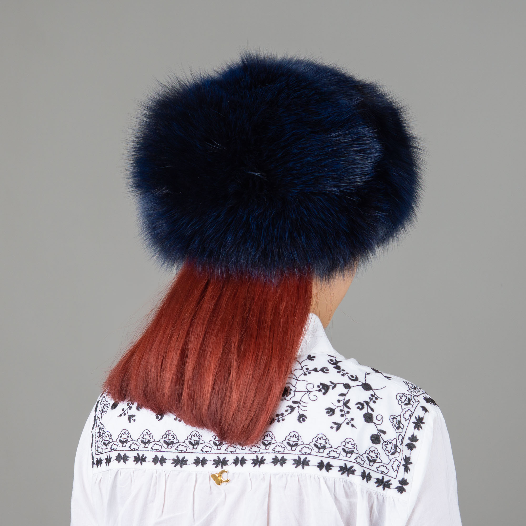 Hat of fox fur in blue color