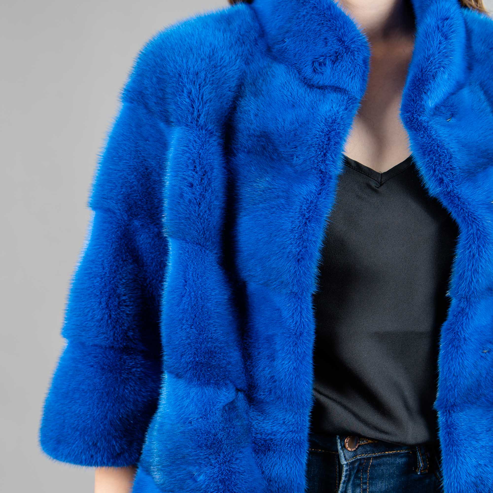 Mink fur jacket with a collar in blue color. 