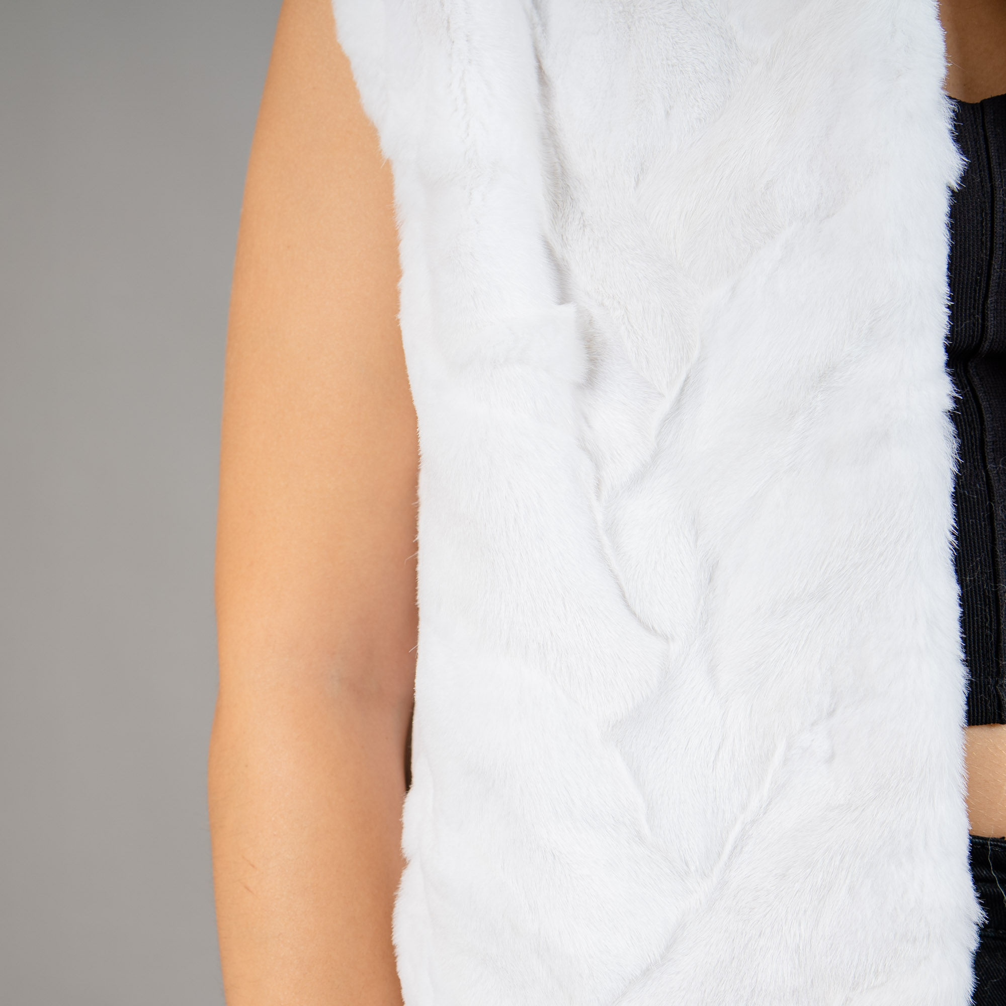 White fox fur vest with a collar. 