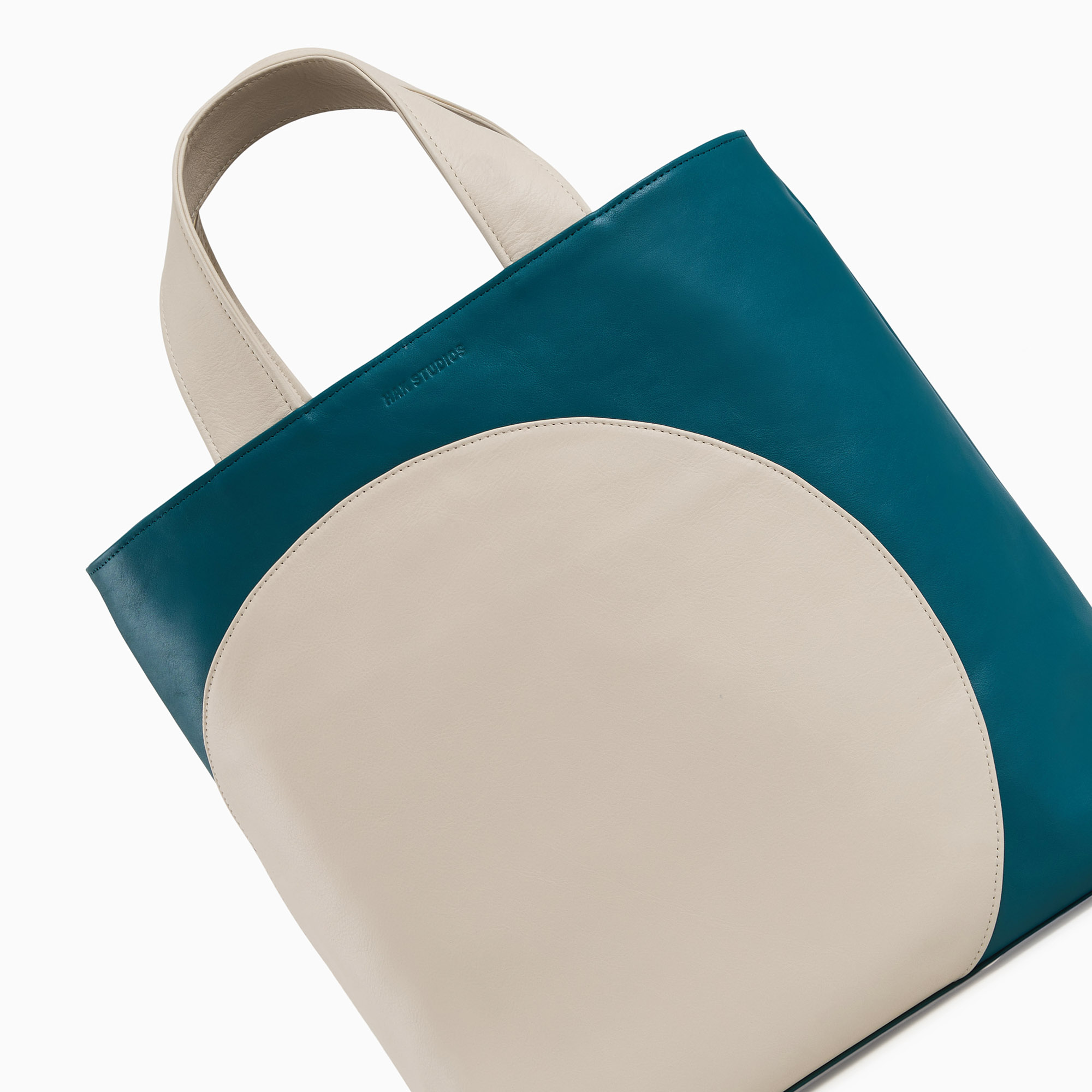 Leather handbag in beige-blue color