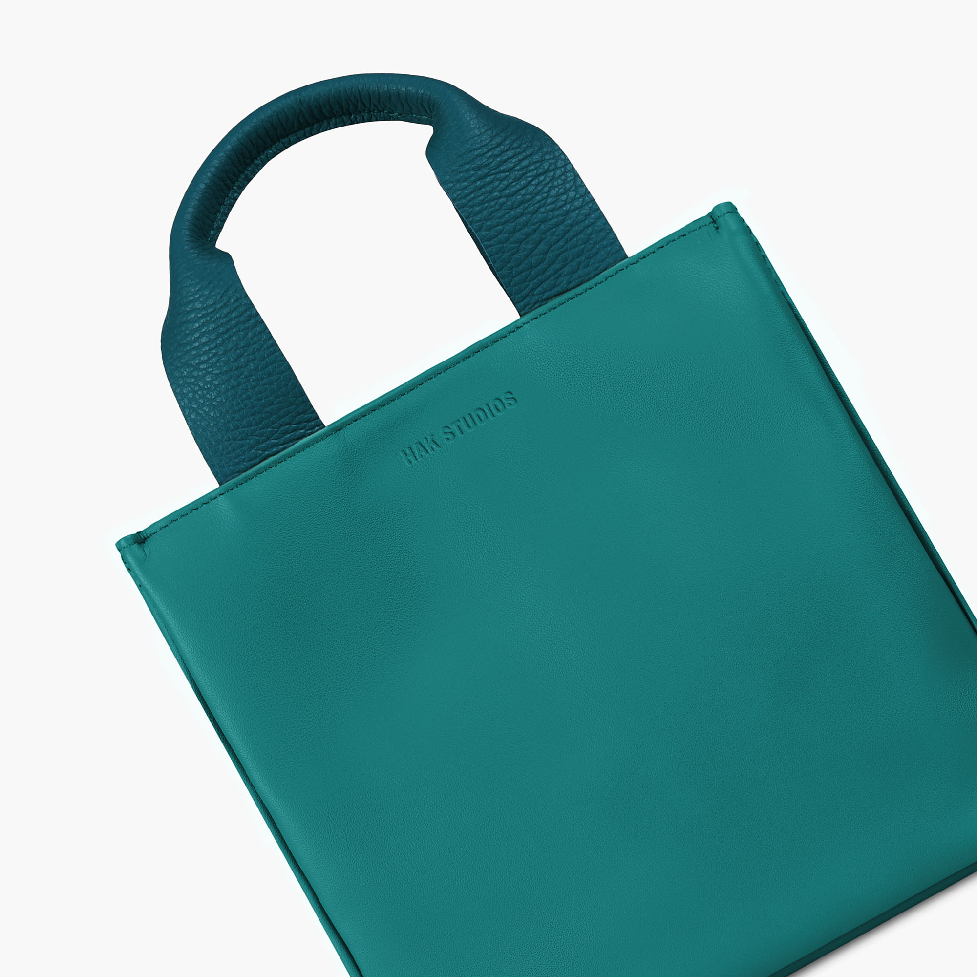 Small leather tote bag in blue color