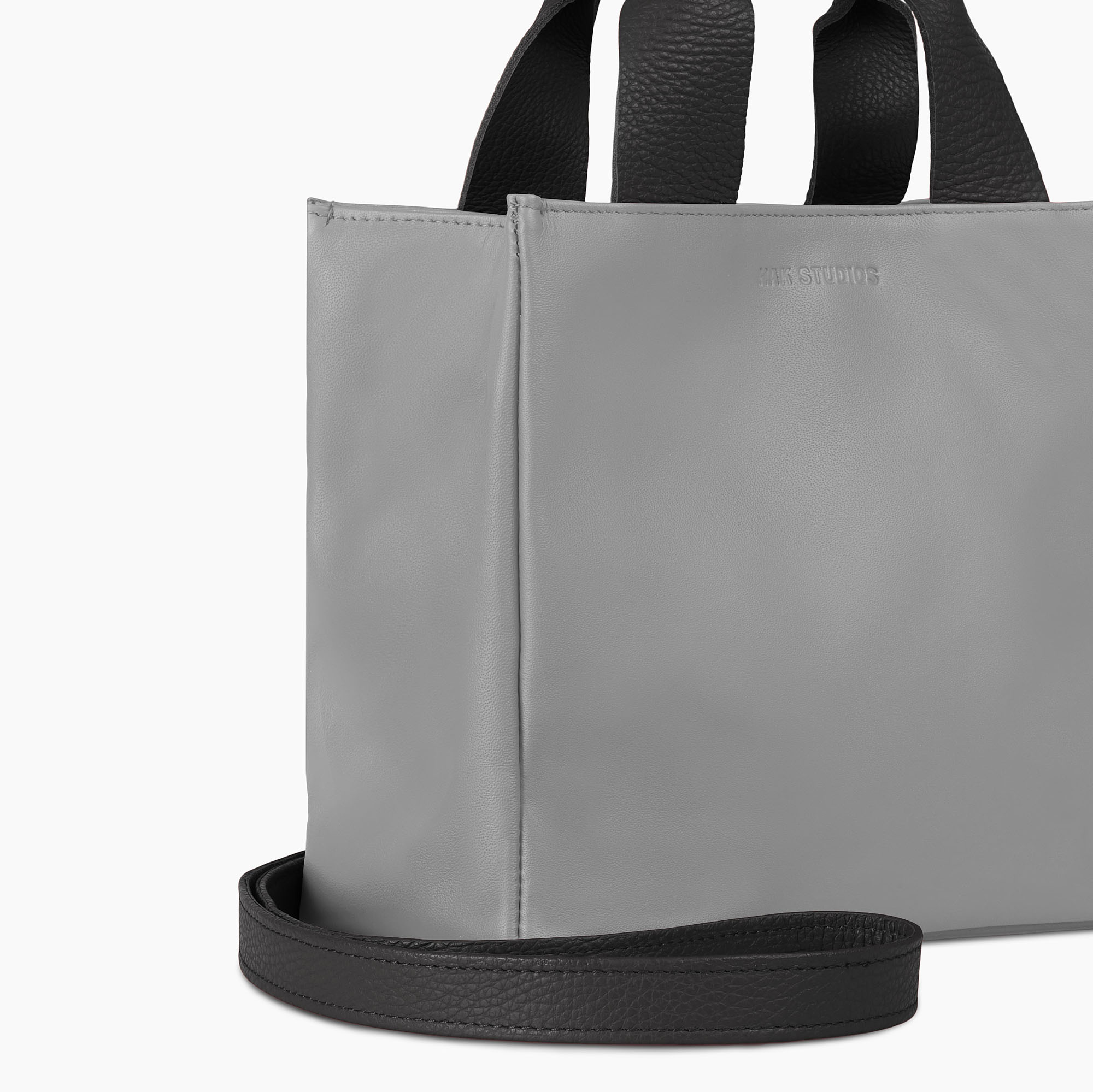 Small leather tote bag in gray color