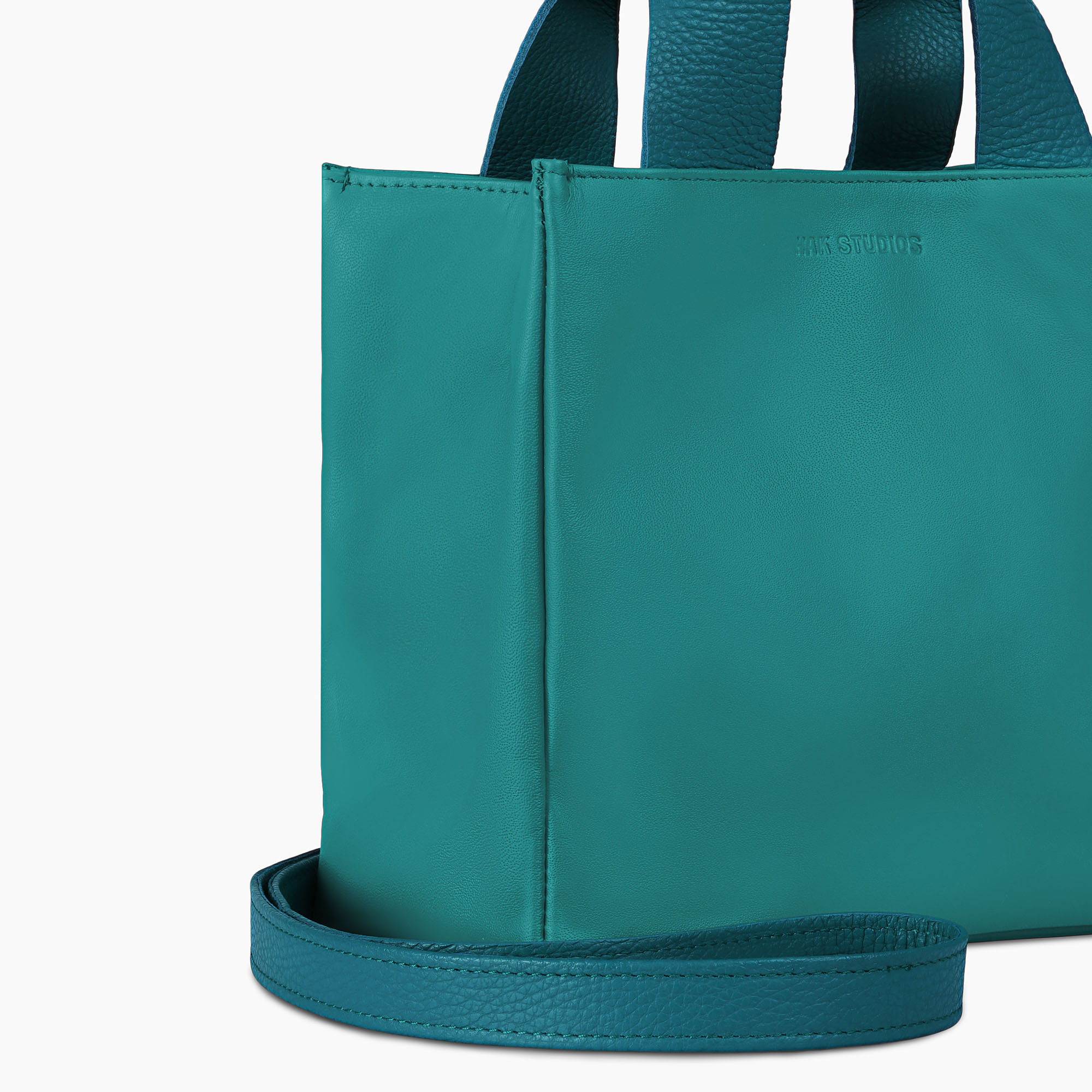 Small leather tote bag in blue color