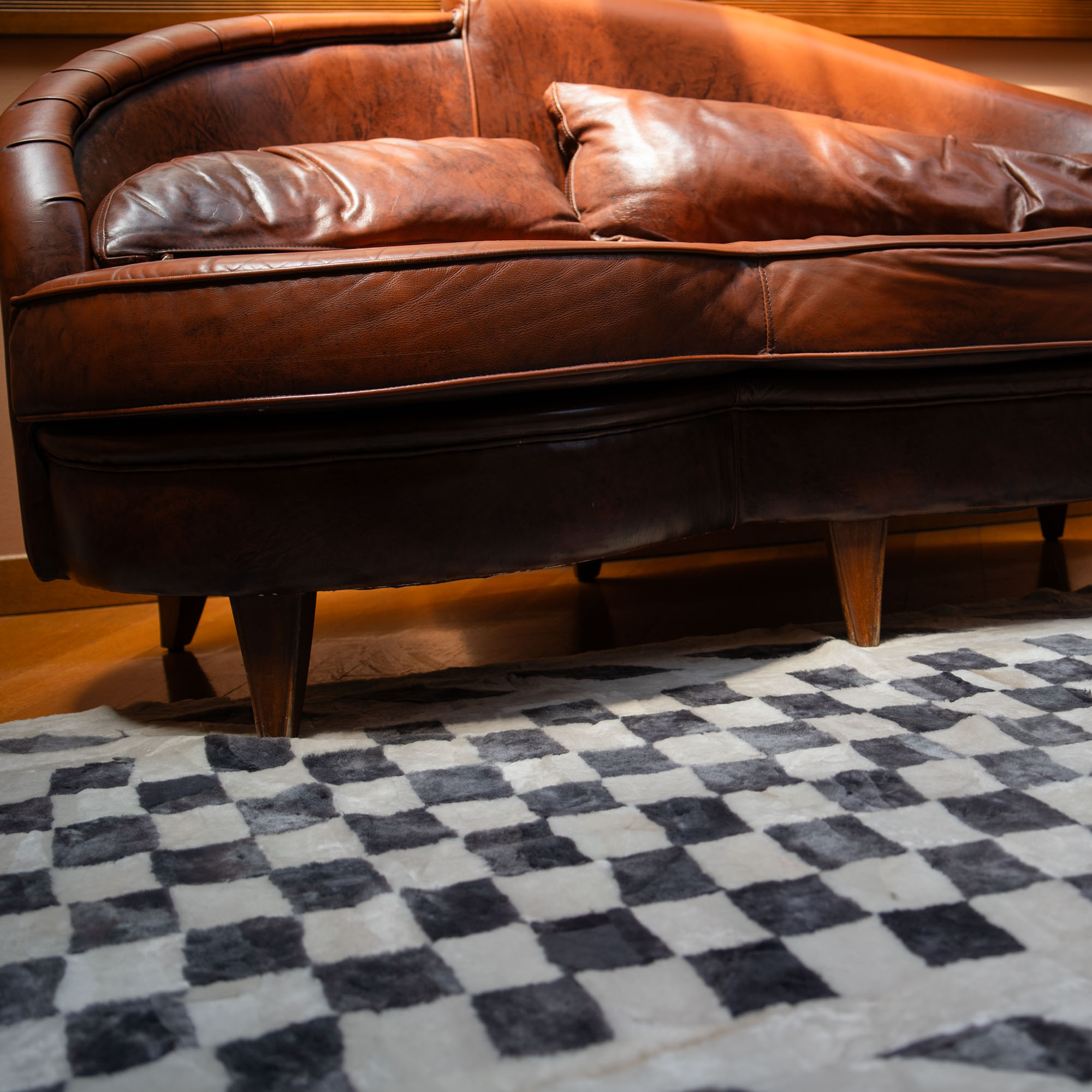 Sheep fur carpet in a gray chess pattern