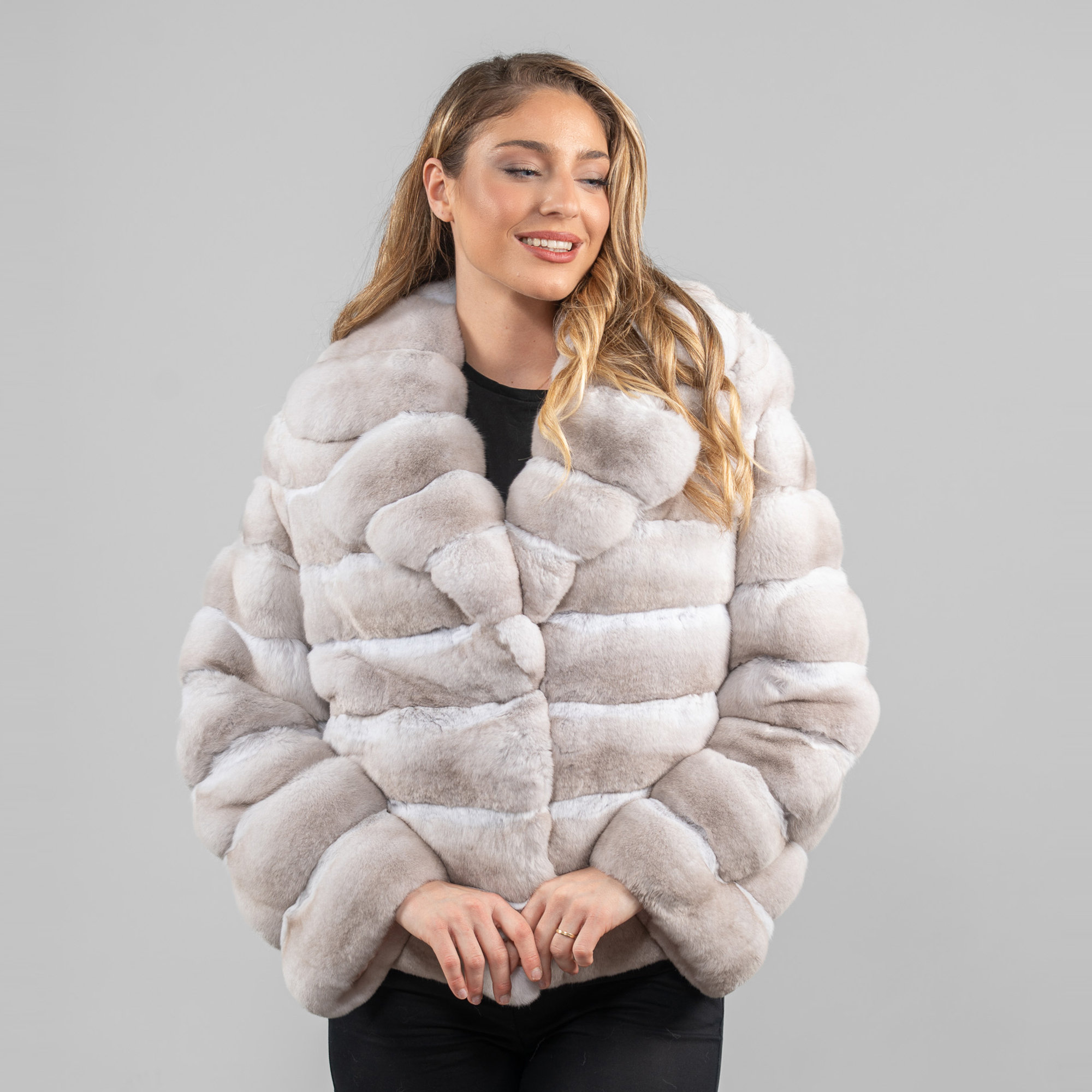 Beige chinchilla fur jacket with a wide collar