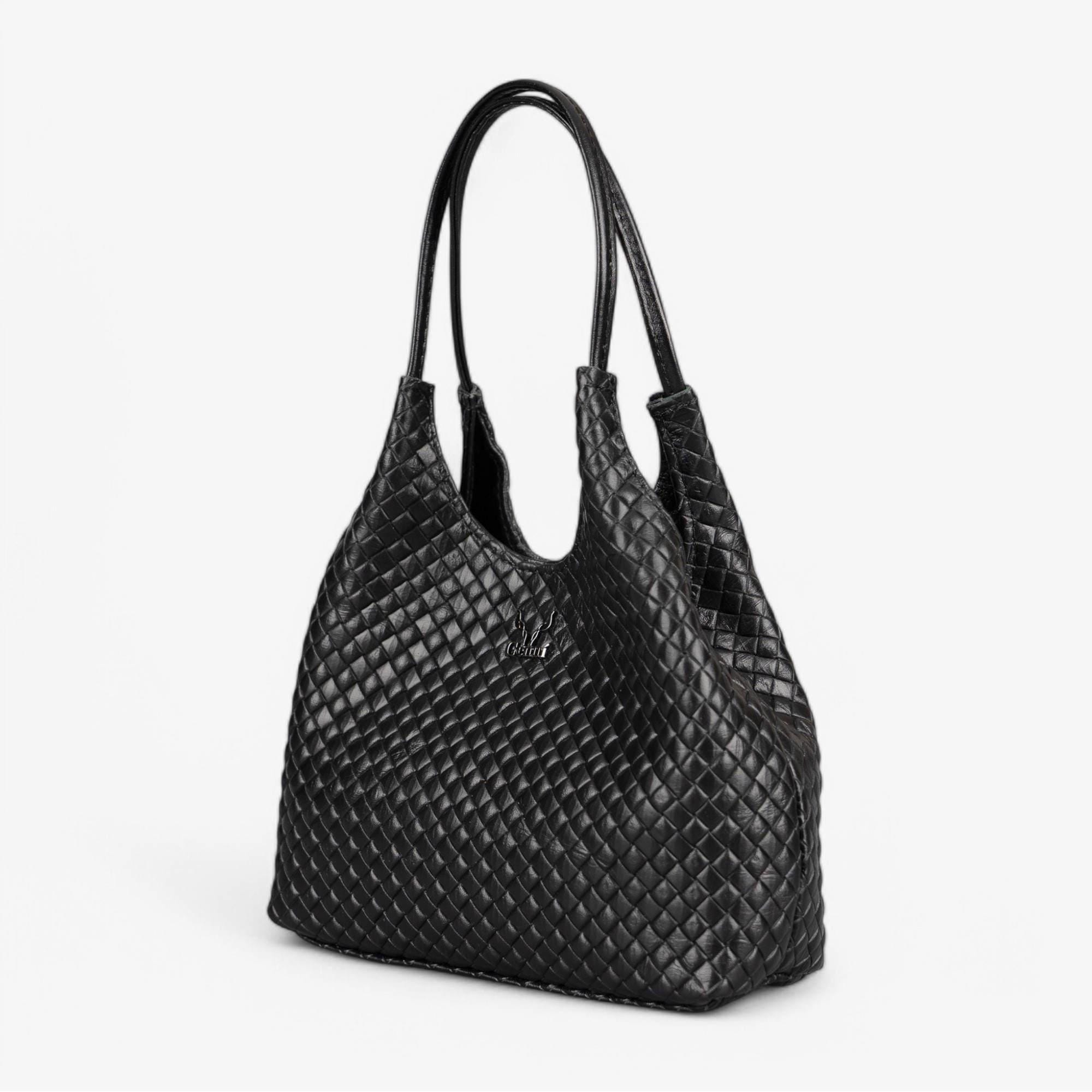 Black leather handbag with basket-embossed texture
