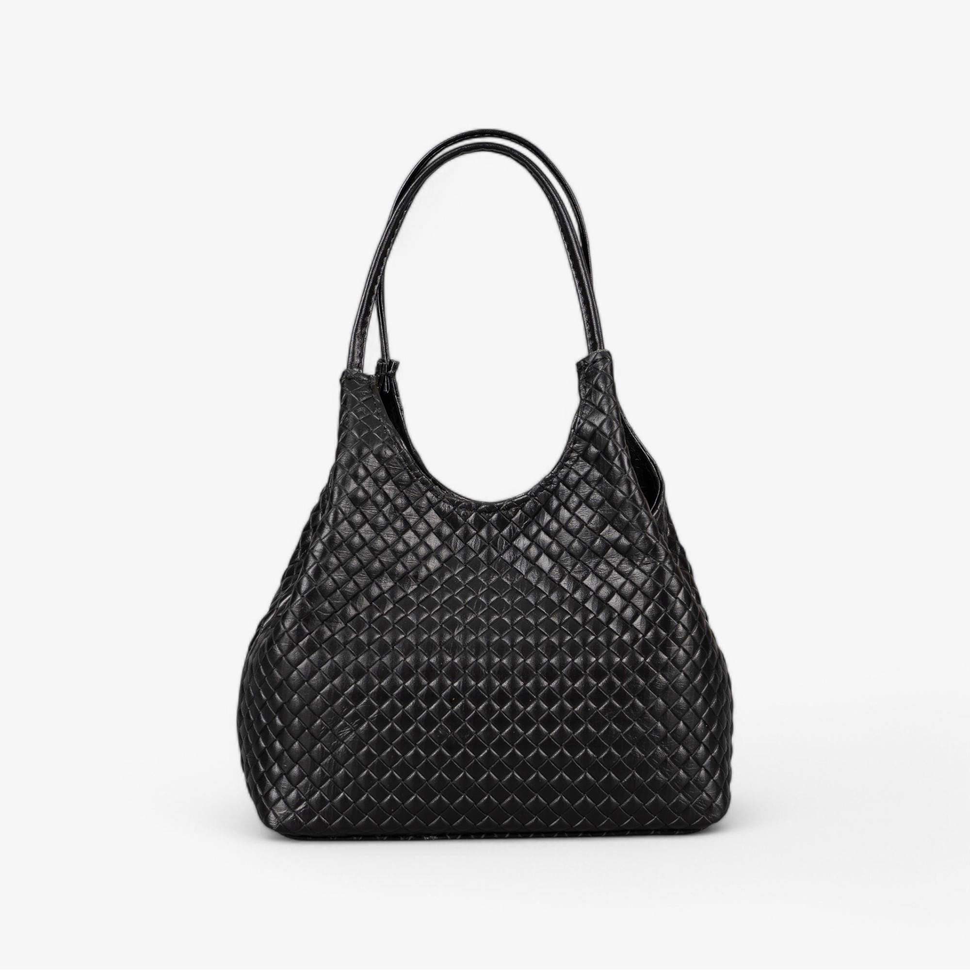 Black leather handbag with basket-embossed texture